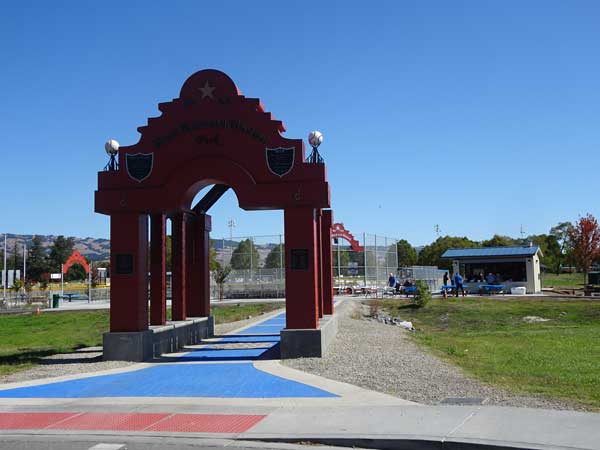 A red archway with a blue and red walkway

Description automatically generated with medium confidence