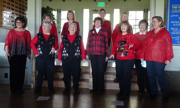 A group of women wearing matching sweaters

Description automatically generated