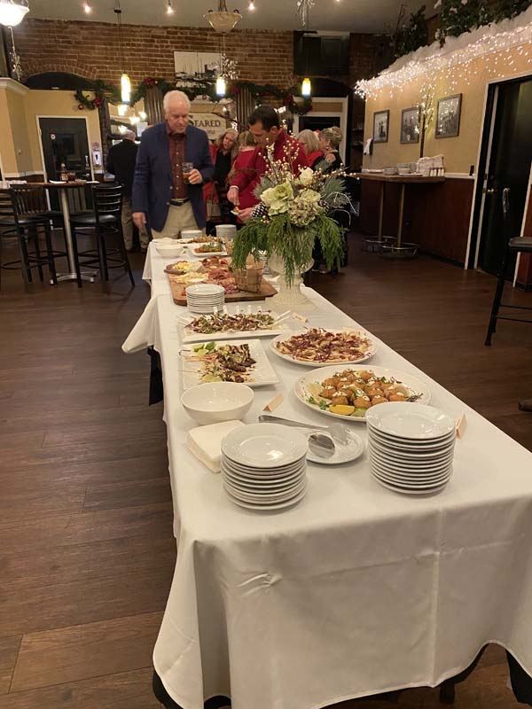 A long table with food on it

Description automatically generated