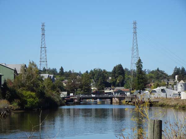 A river with a bridge and towers

Description automatically generated