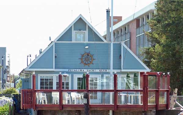 A blue building with a red railing

Description automatically generated