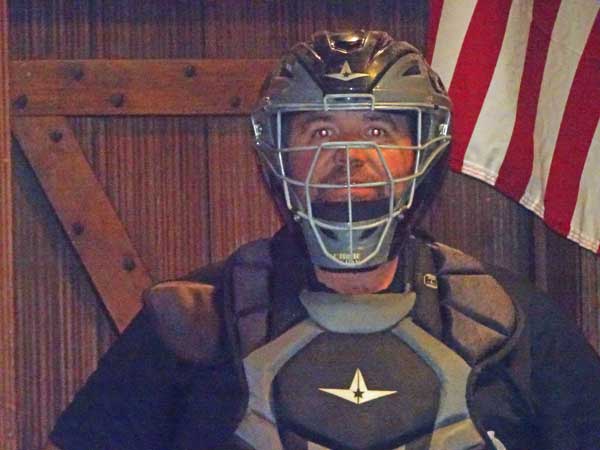 A person wearing a mask and chest protector

Description automatically generated