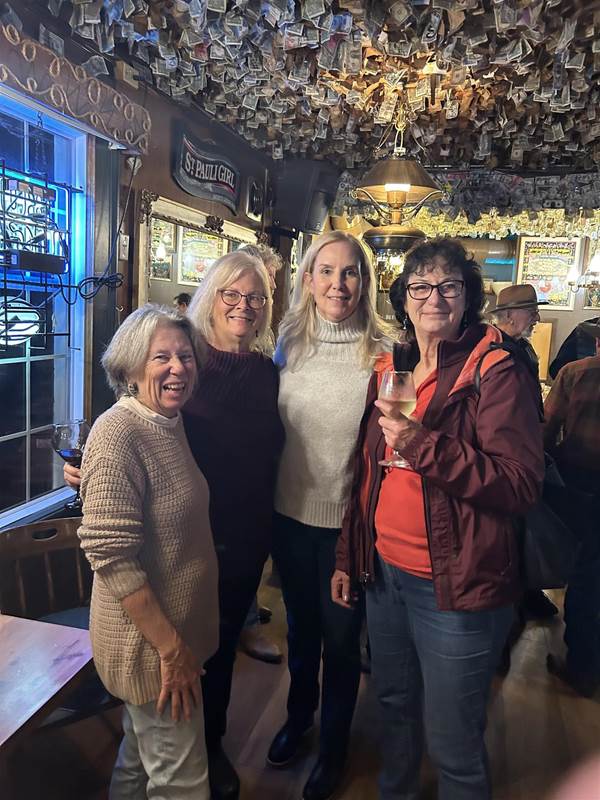 A group of women posing for a photo

Description automatically generated