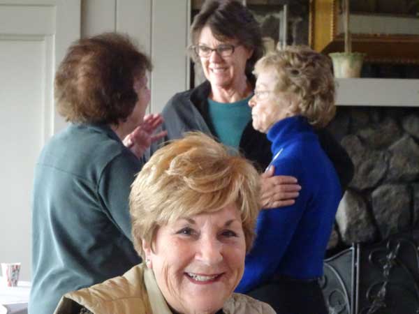 A group of older women smiling

Description automatically generated