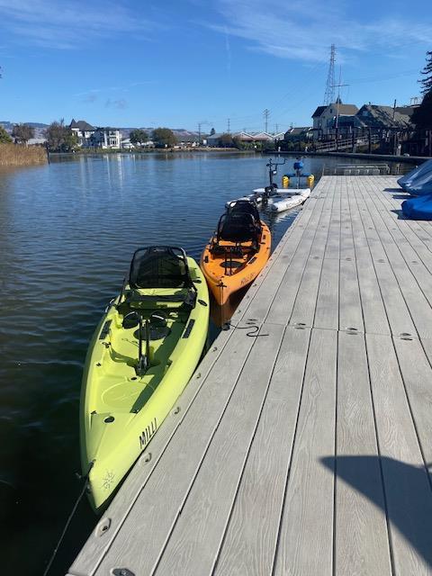 Two kayaks on a dock

Description automatically generated