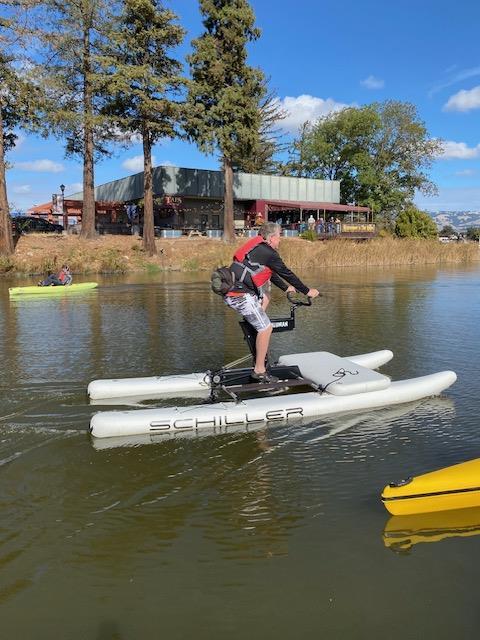 A person on a small white boat

Description automatically generated